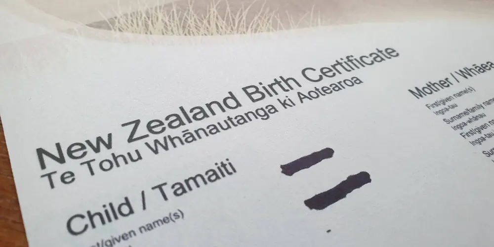 Official New Zealand birth certificate ordered online through NZ Document Assist, personal details hidden